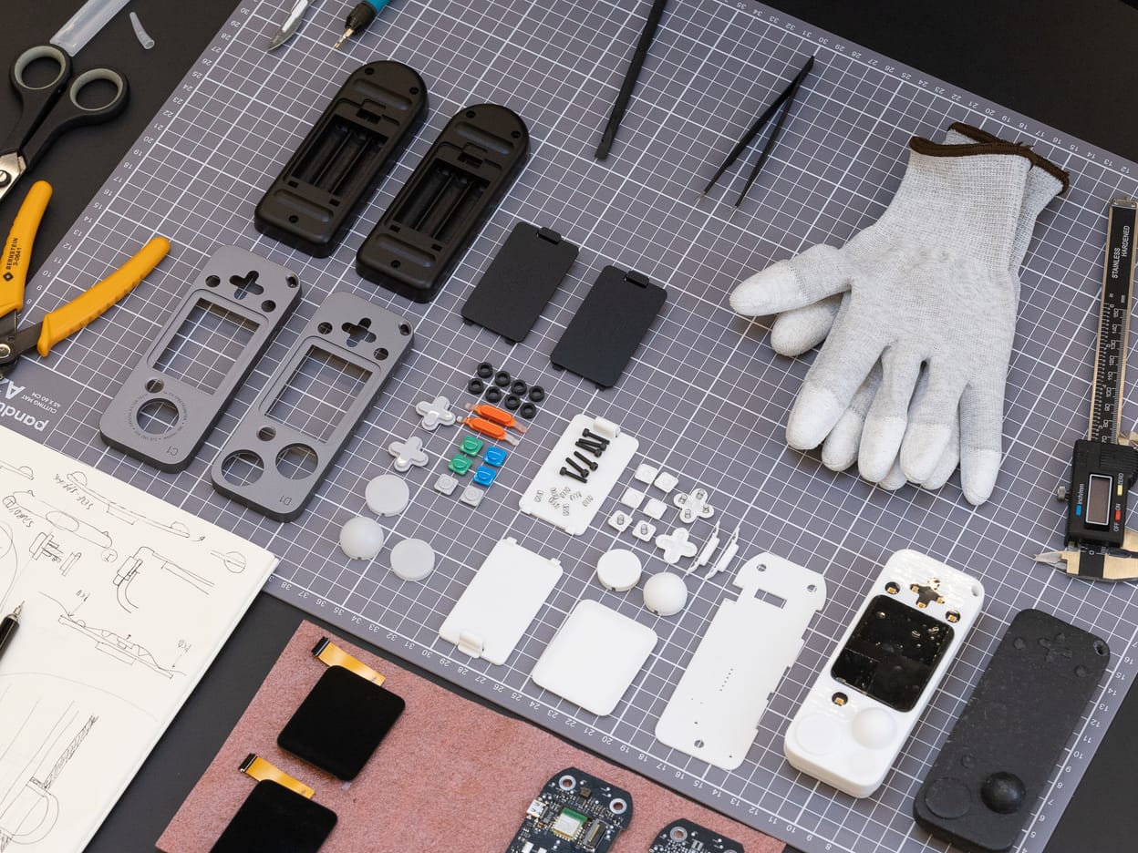 LIT light meter parts, tools and assembly work on a bench.