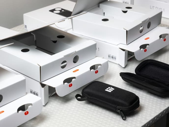 LIT light meters and enclosure components during assembly.