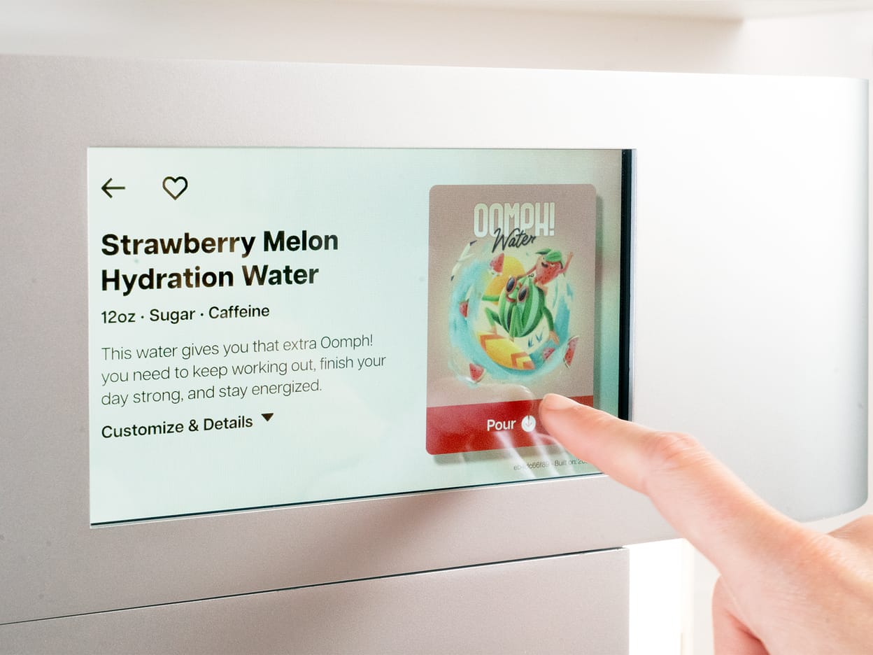 Selecting a drink on the Cana touchscreen.