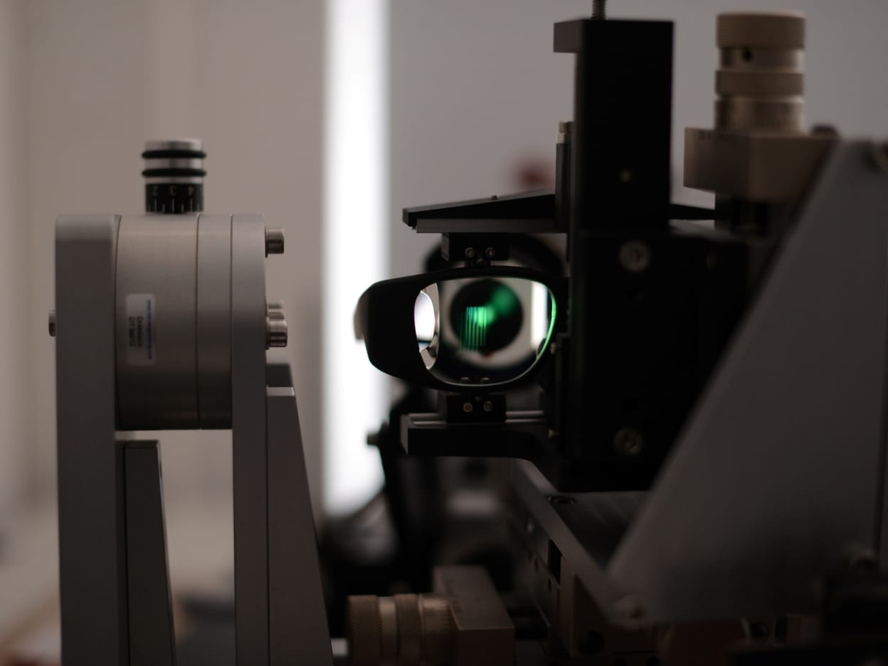 Zeiss optical test equipment with an illuminated lens.