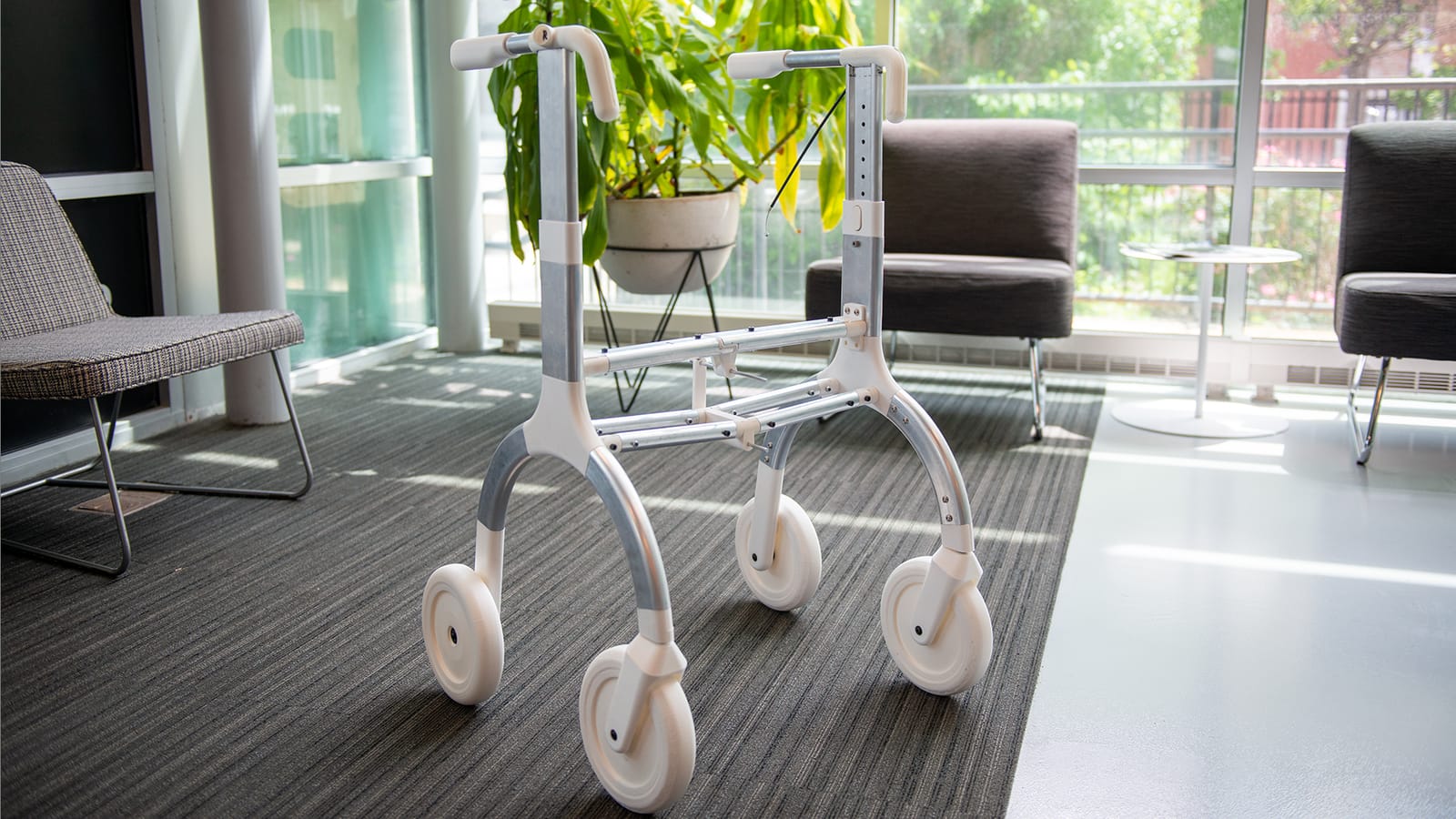 Peppermint rollator beside lounge seating.